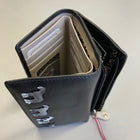 Black Tri Fold Leather Purse with four black, white and grey horses stitched on the front. The purse is open showing card and cash slots inside and a zip top opening on the back for coins.