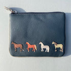 A small navy leather coin purse with four coloured horses stitched on the front. A zip top opening.